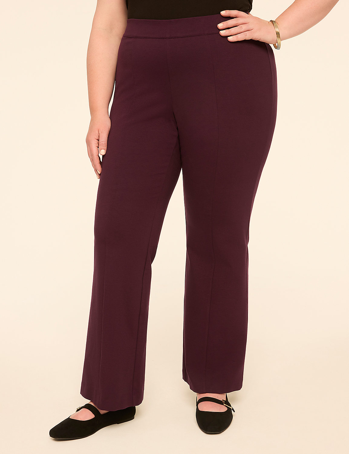 A person wearing plum-colored pants and black flats stands against a plain, light-colored background. Product Image 1