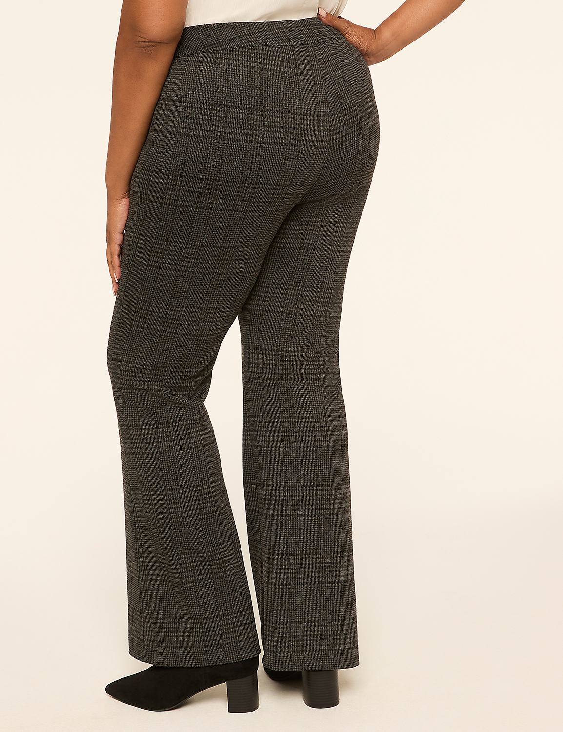 A person wearing plaid flared pants stands against a plain, light-colored background. Product Image 2
