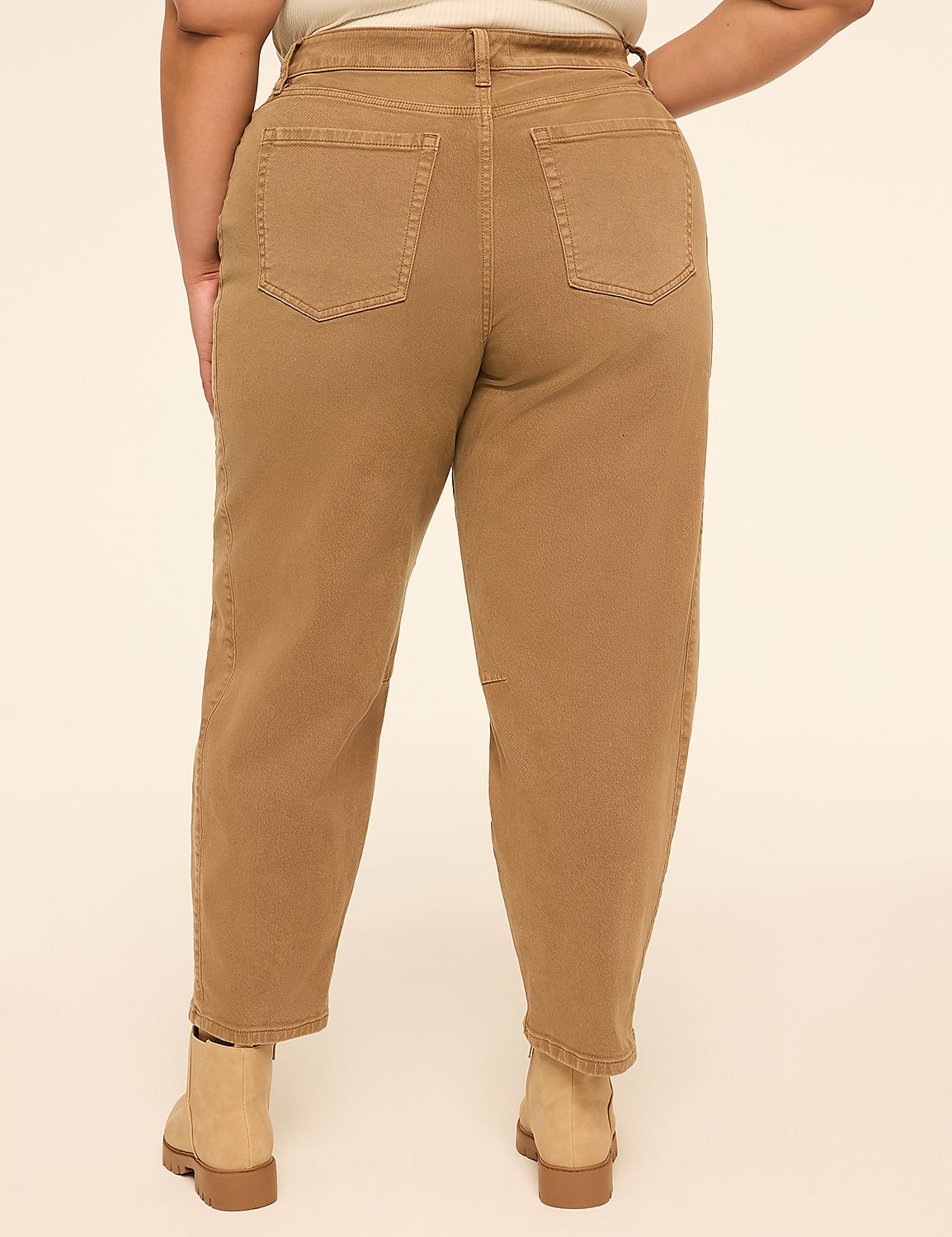 A person wearing tan jeans and boots stands against a plain, light-colored background. Product Image 2
