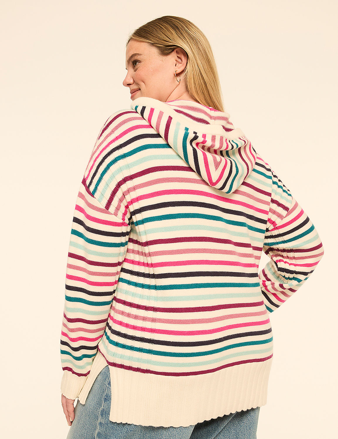 A woman in a striped hoodie stands against a plain, light-colored background. Product Image 2