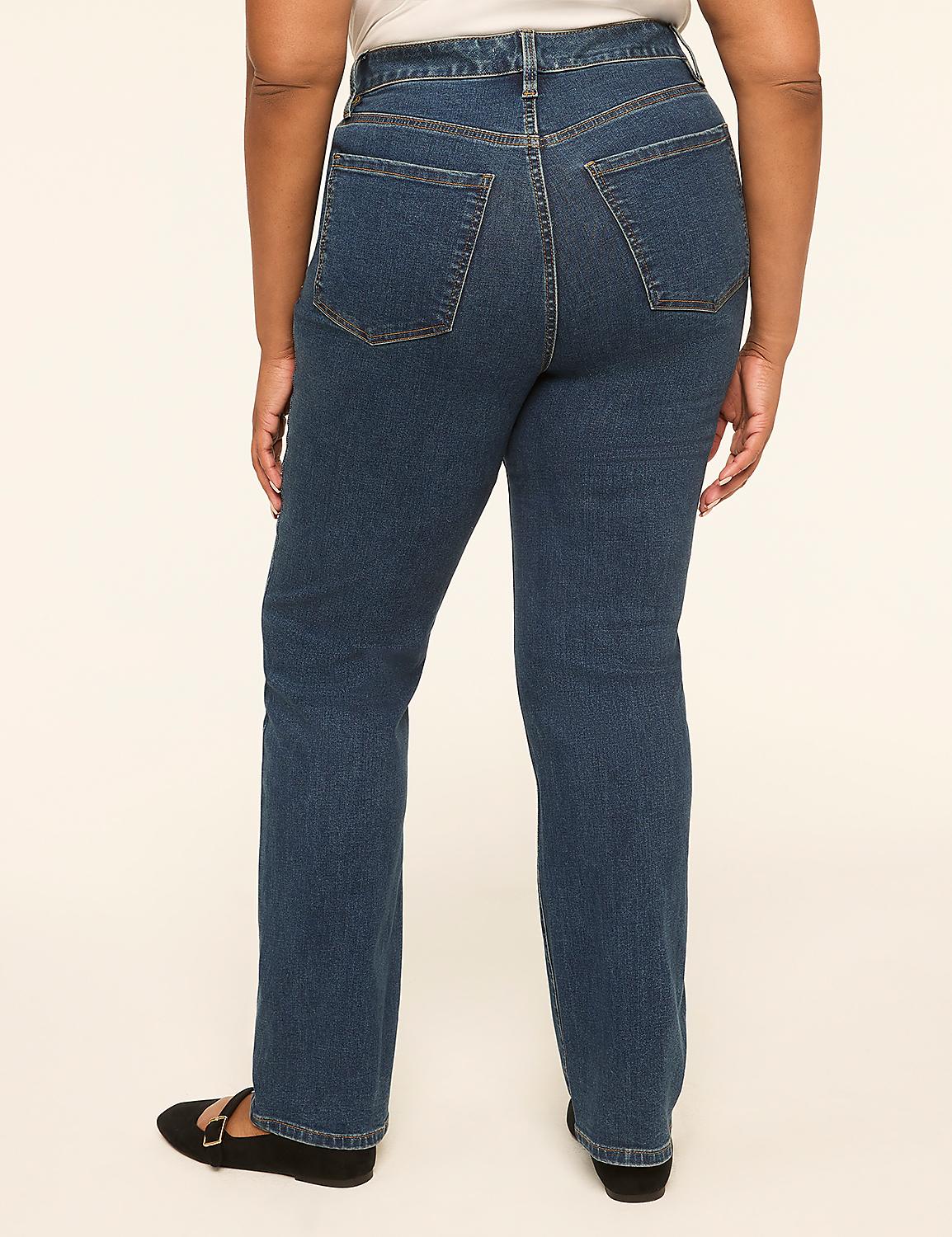 A person wearing dark wash denim jeans and black flats stands against a plain, light-colored background. Product Image 5