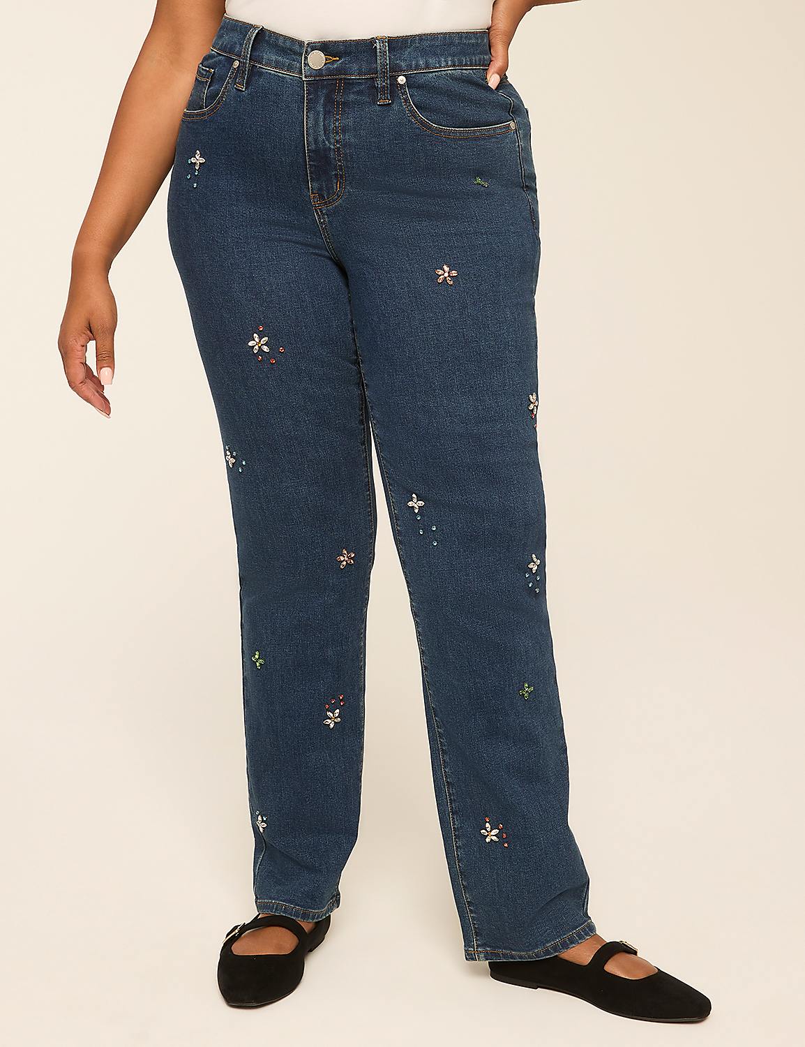 A person wearing embroidered denim jeans stands against a plain, light-colored background. Product Image 2