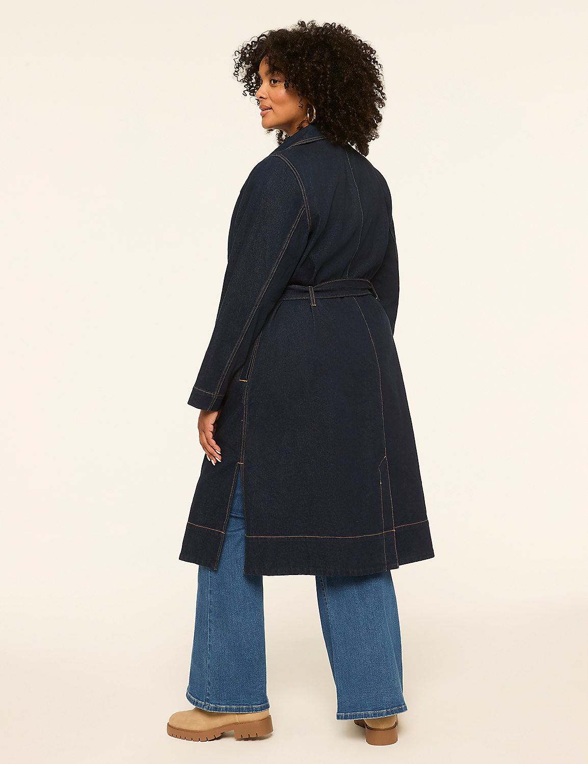 A woman in a denim trench coat and wide-leg jeans stands against a plain, light-colored background. Product Image 2