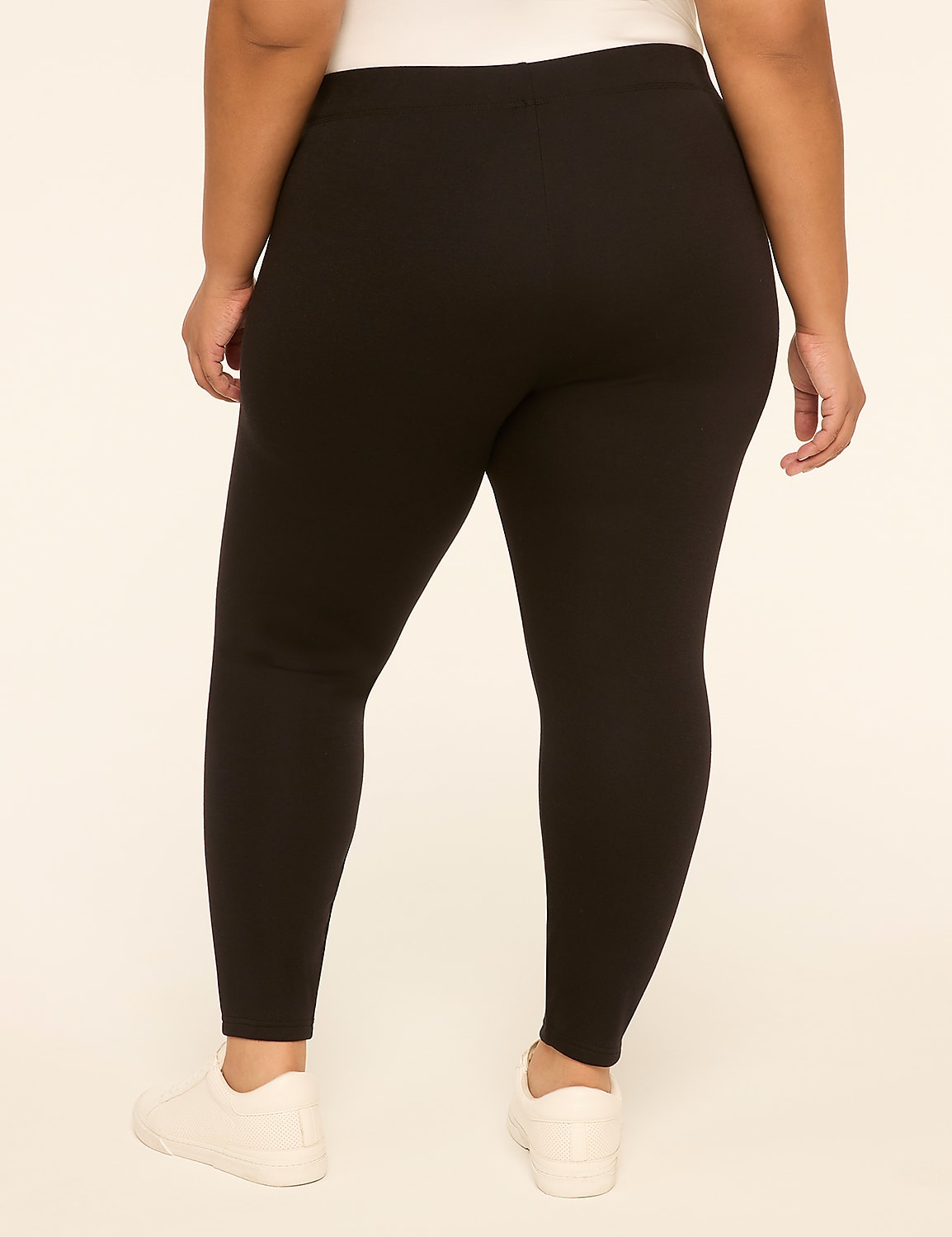 A person wearing black leggings and white sneakers stands against a plain, light-colored background. Product Image 2