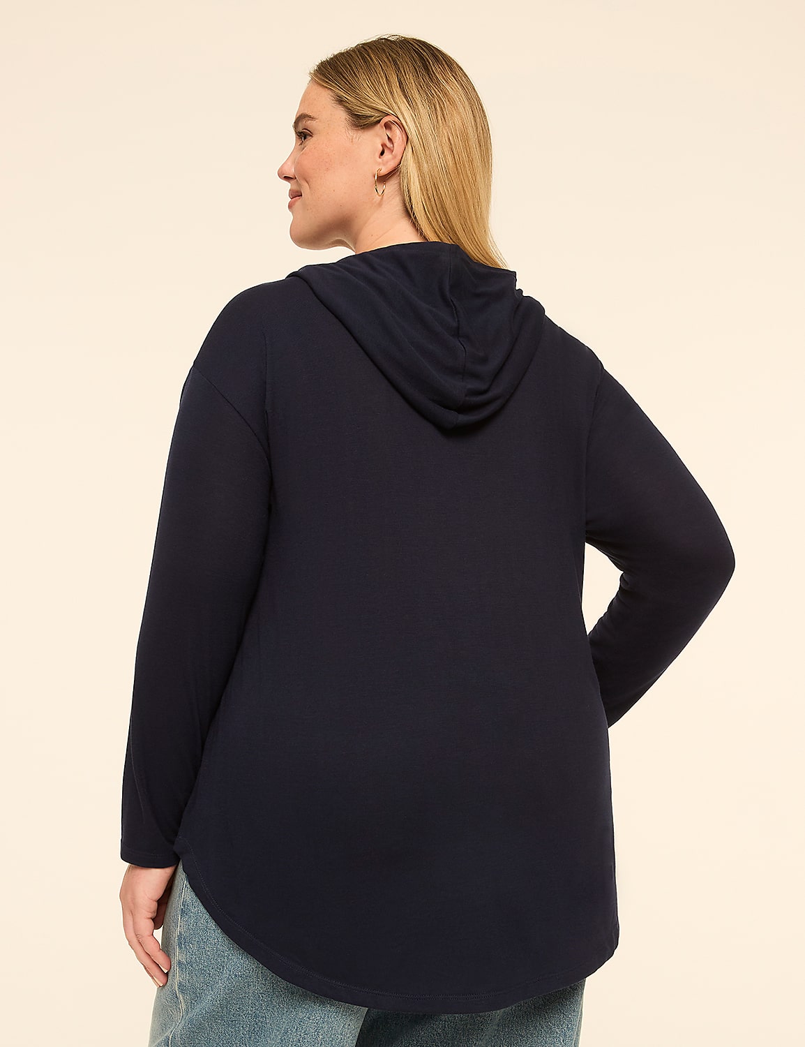 A woman in a navy blue hooded sweatshirt and jeans stands against a plain, light-colored background. Product Image 2