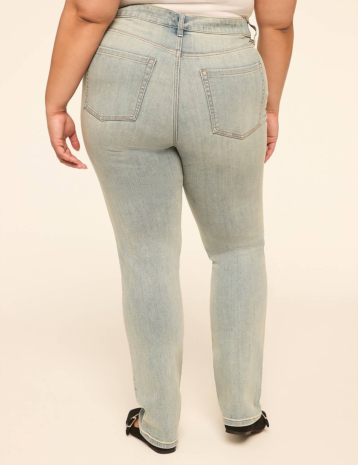 A person wearing light-wash denim jeans stands against a plain, light-colored background. Product Image 2