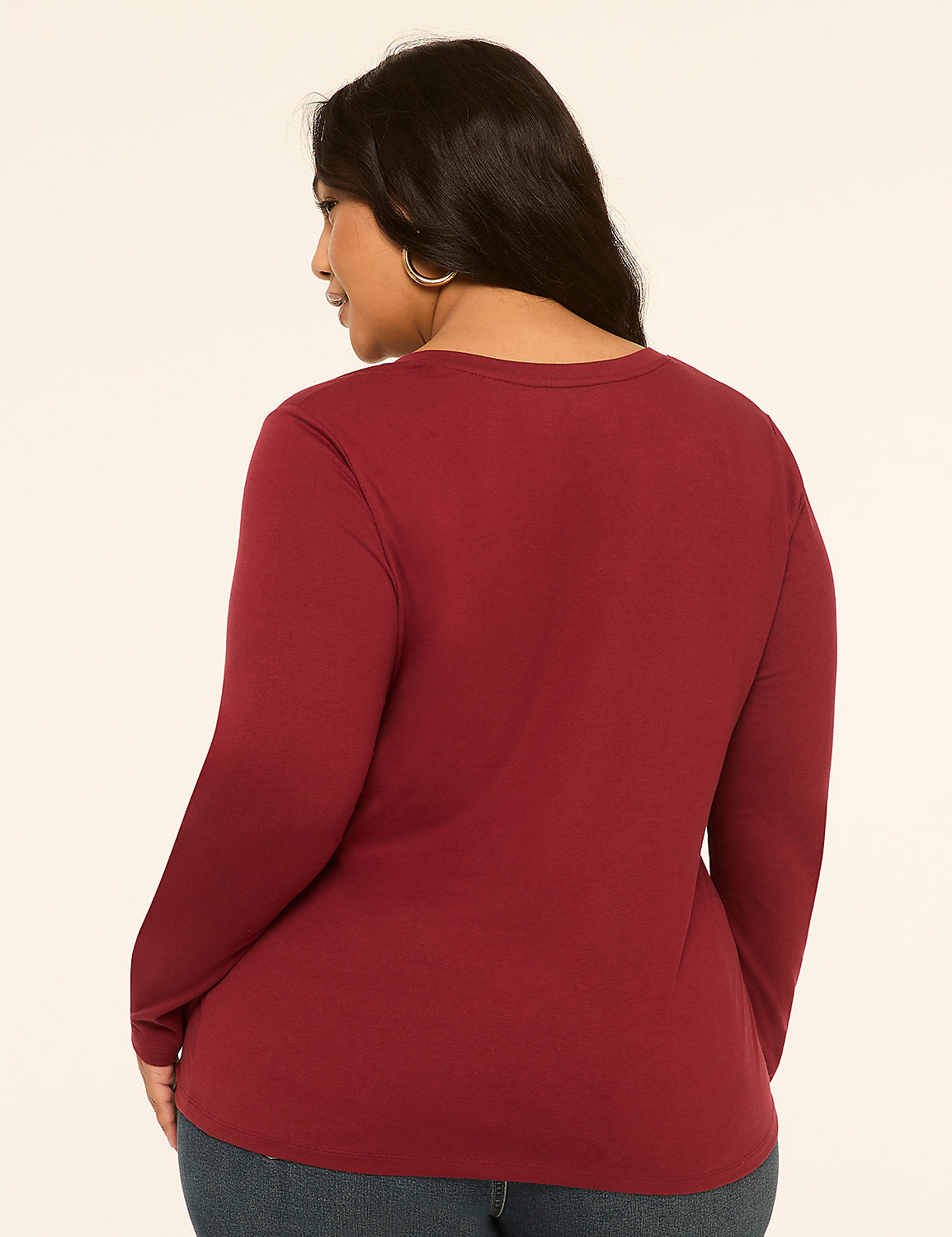A woman in a maroon long-sleeved shirt stands against a plain, light-colored background. Product Image 2
