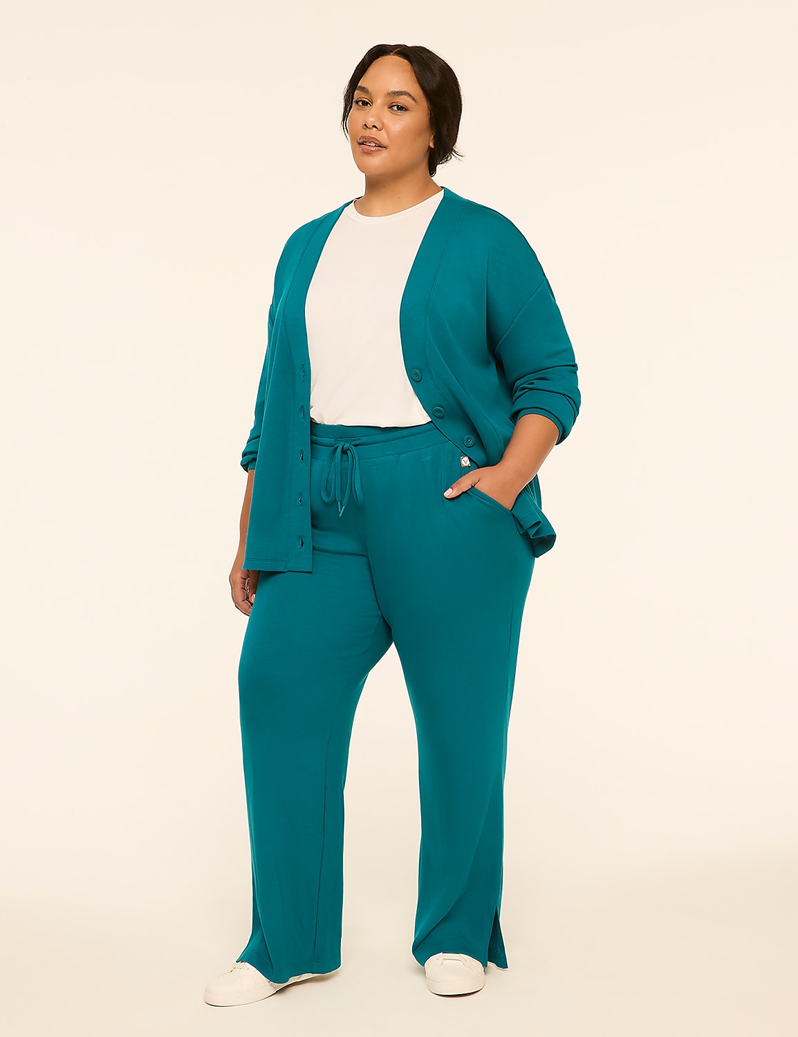 A woman in a teal cardigan and matching pants stands against a plain, light-colored background. Product Image 3