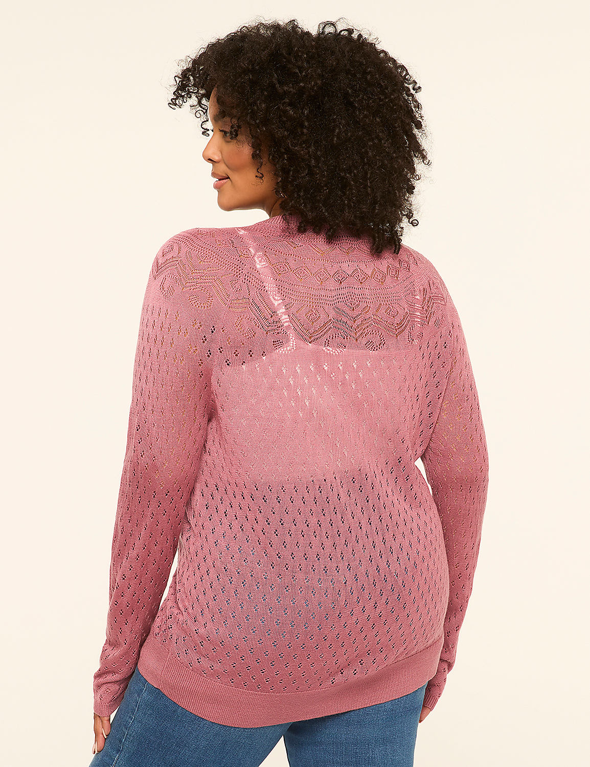 A woman in a pink open-knit cardigan stands against a plain, light-colored background. Product Image 2