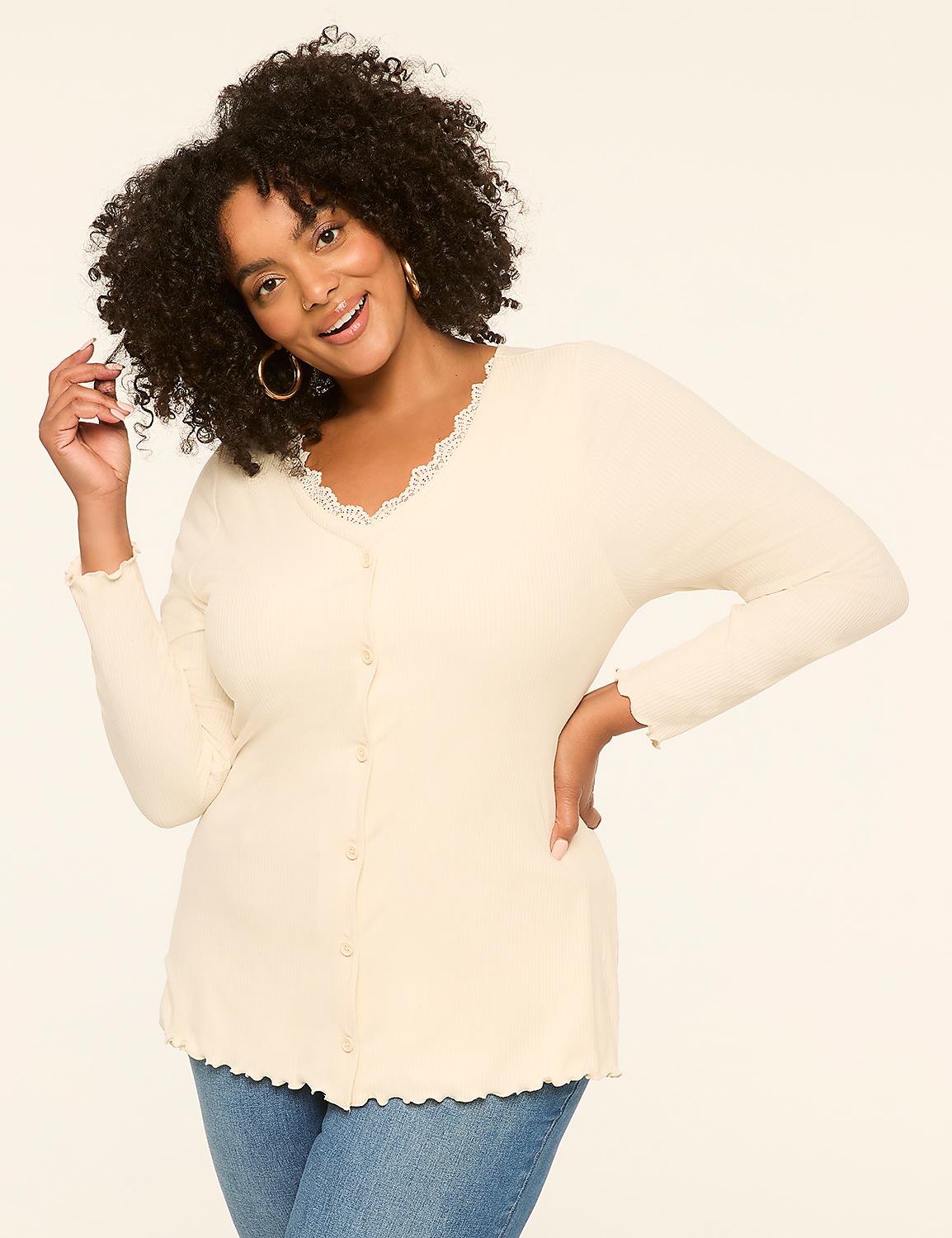 A smiling woman with curly hair in a cream-colored top and blue jeans poses against a plain, light-colored background. Product Image 1