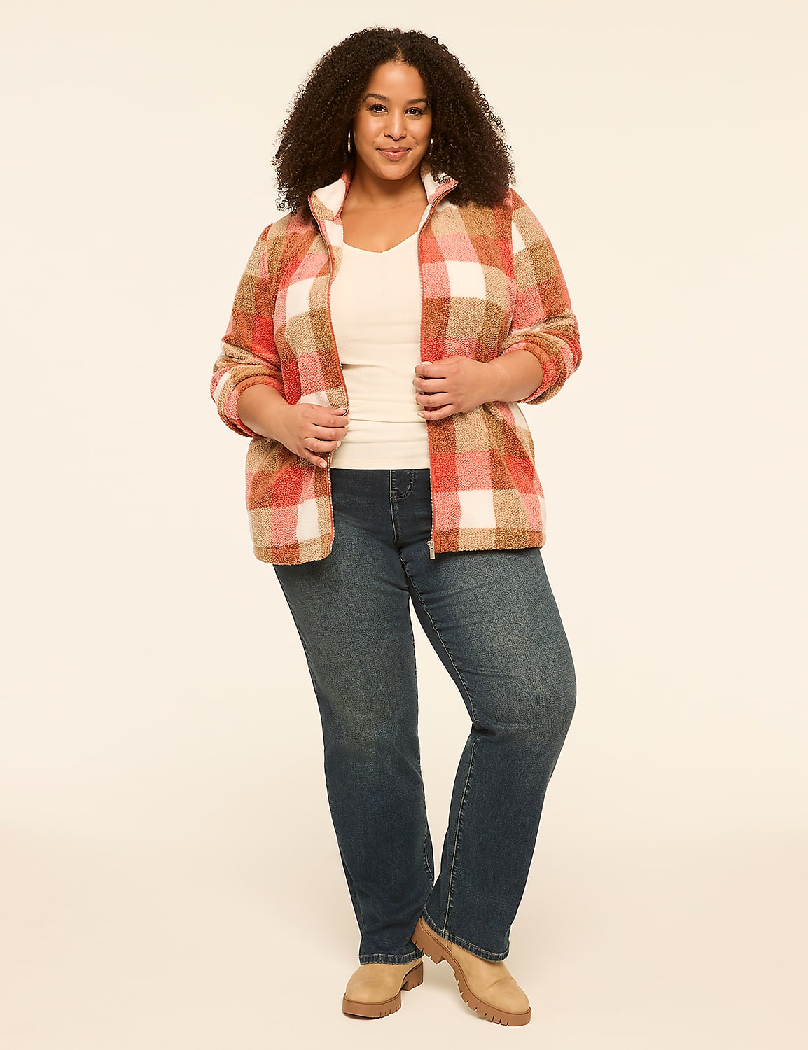 A woman in a plaid jacket and jeans stands against a plain, light-colored background. Product Image 3