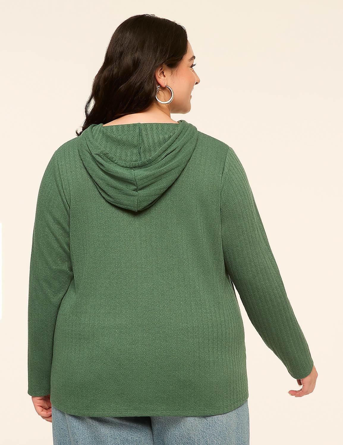 A woman in a green hooded sweatshirt stands against a plain, light-colored background. Product Image 2