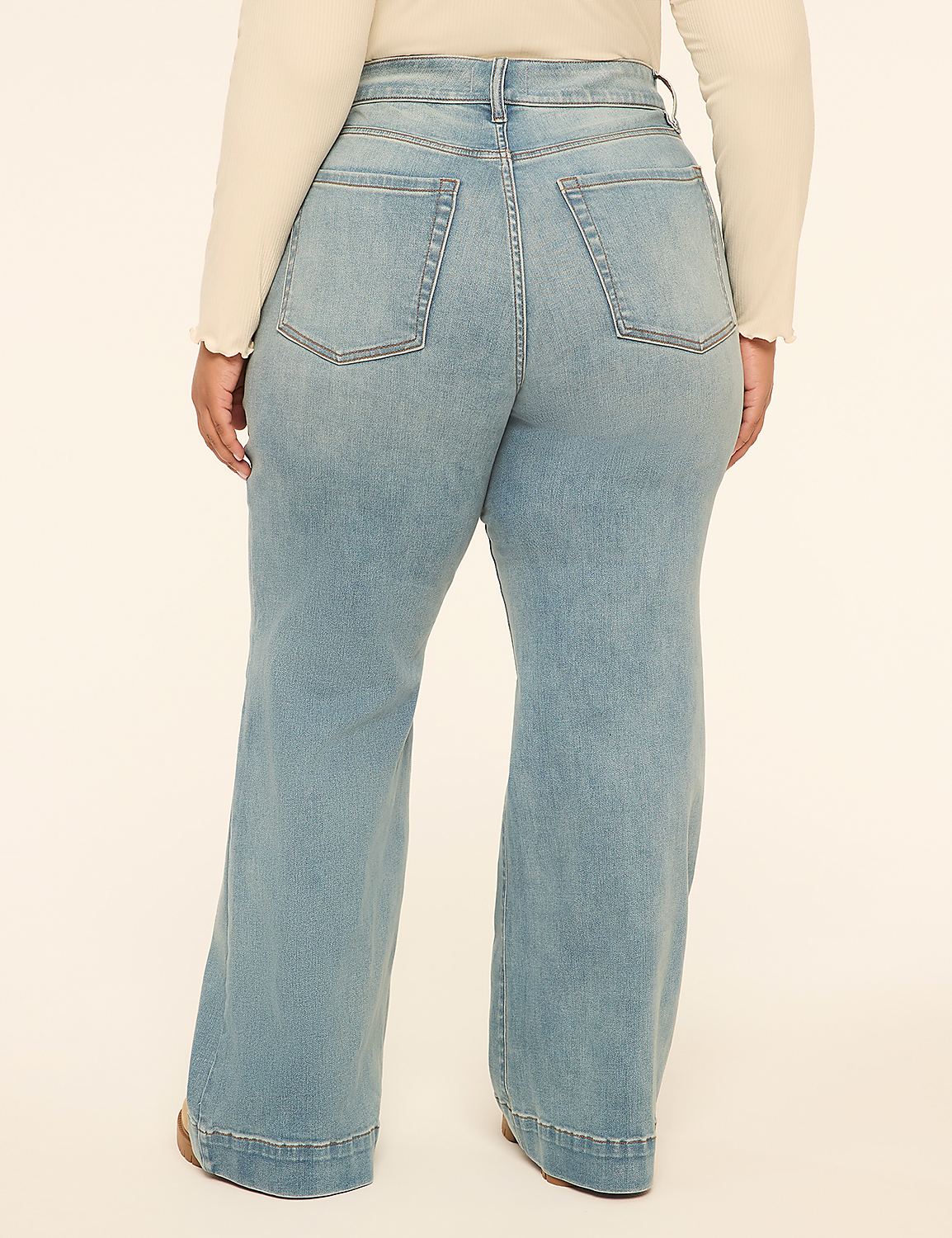 A person wearing light wash wide-leg jeans stands against a plain, light-colored background. Product Image 2
