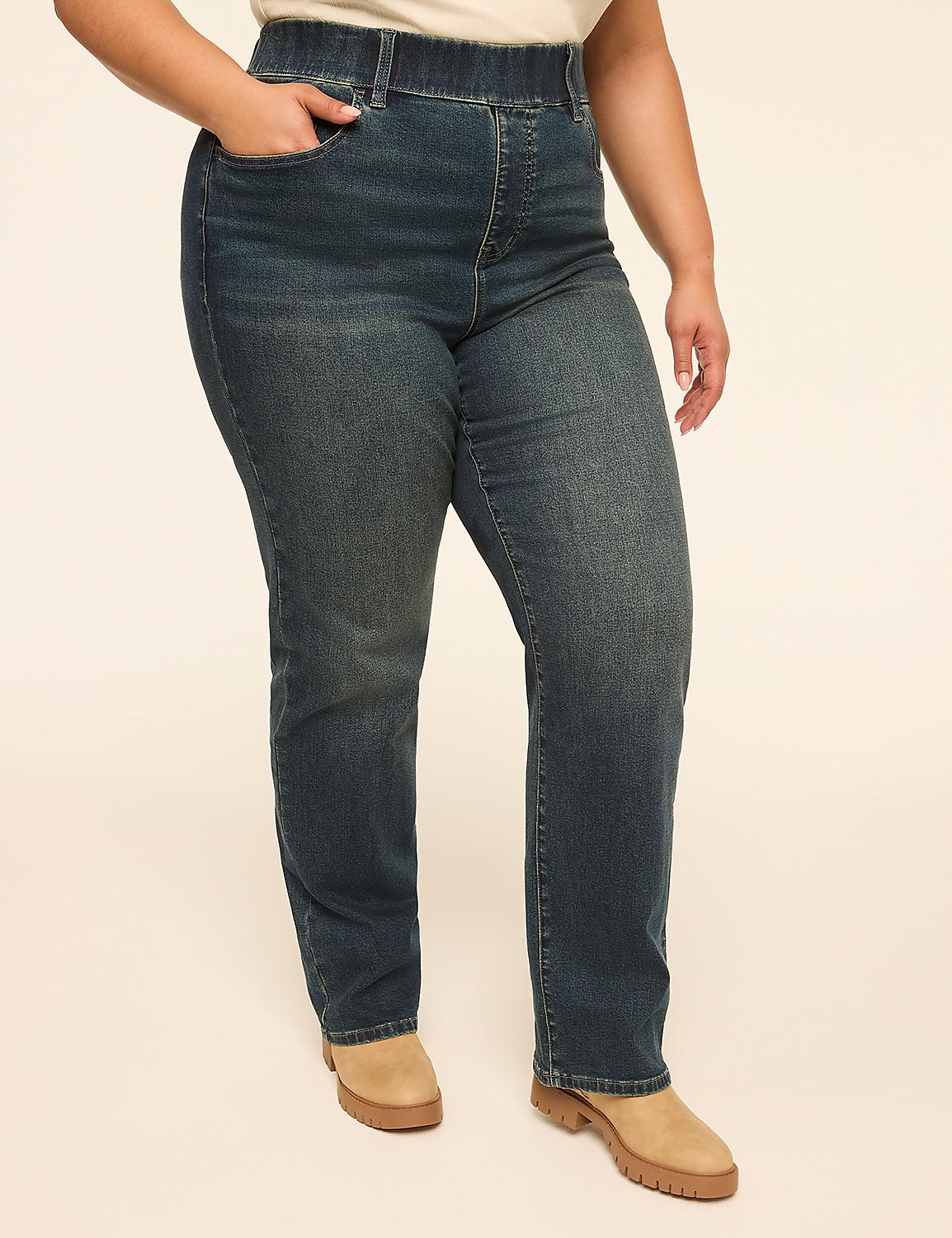 A person wearing dark wash denim jeans and tan boots stands against a plain, light-colored background. Product Image 1