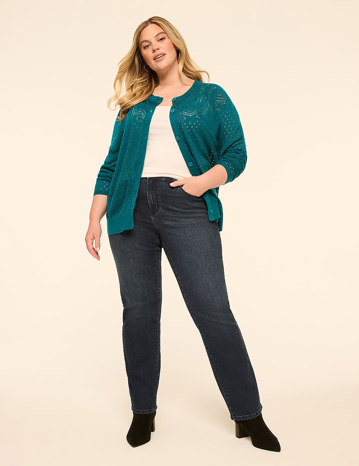 A woman in a teal cardigan and dark jeans stands against a plain, light-colored background. Product Image 3