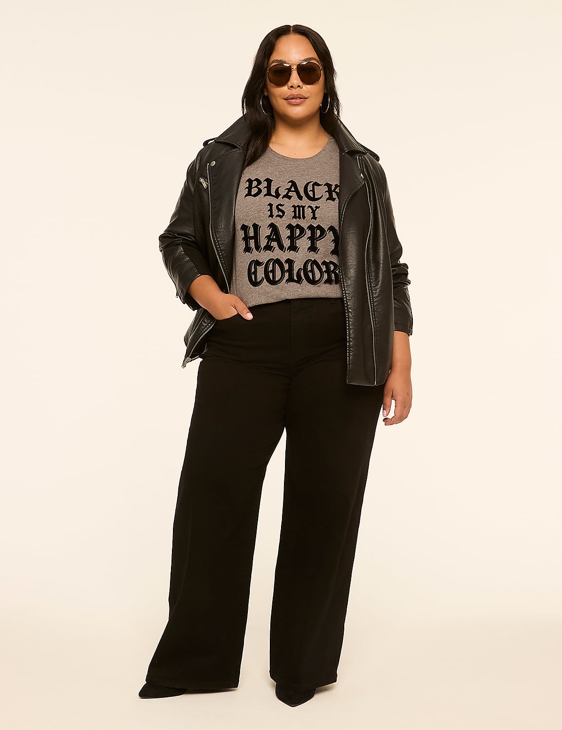 A woman in a leather jacket and wide-leg pants stands against a plain, light-colored background. Product Image 3