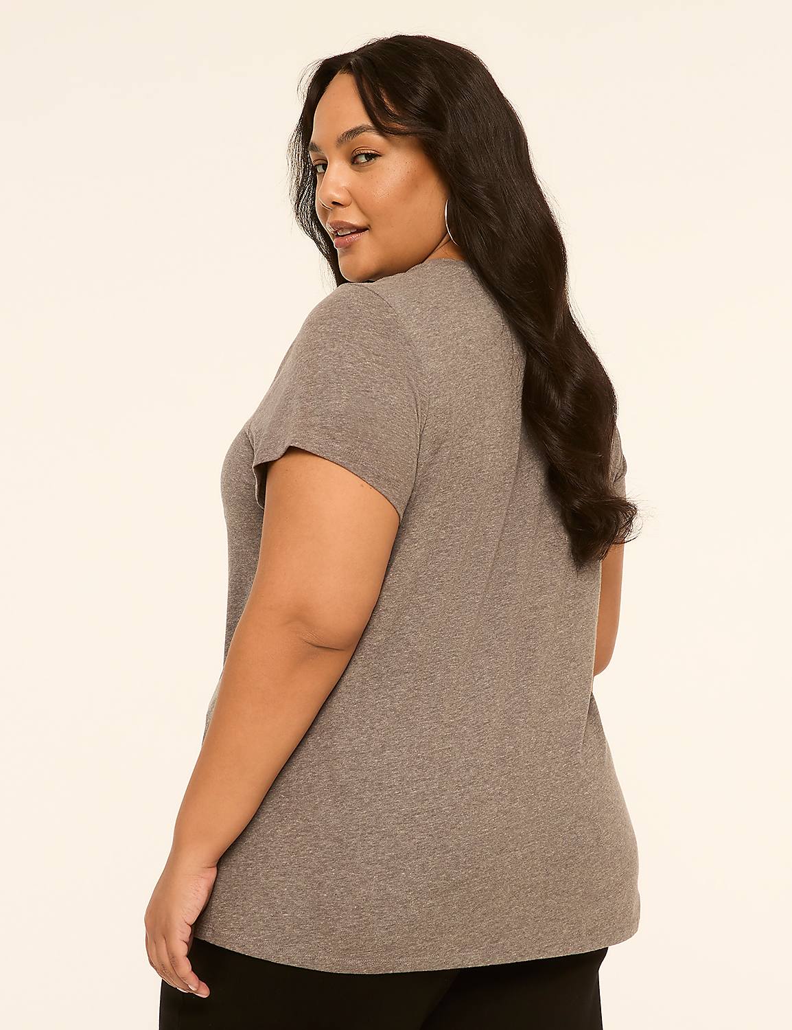 A woman in a gray t-shirt and black pants stands against a plain, light-colored background. Product Image 2