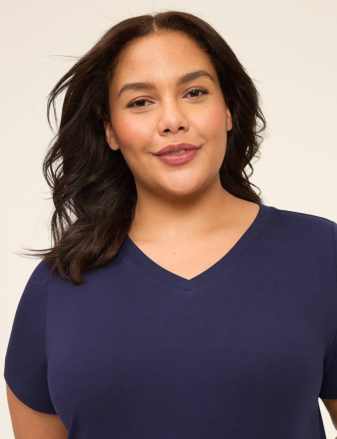 A woman with dark hair and a v-neck shirt smiles at the camera against a plain, light-colored background. Product Image 3