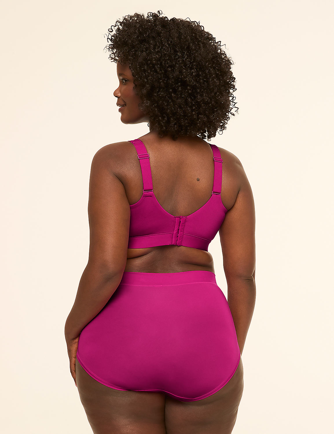 A woman in a magenta bra and high-waisted briefs stands against a plain, light background. Product Image 2