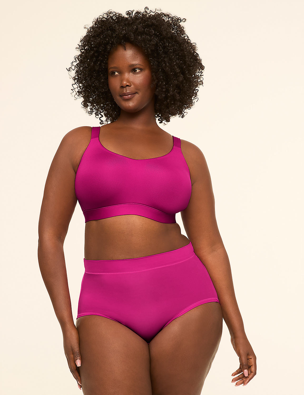 A woman in a magenta bra and matching high-waisted underwear stands against a plain, light-colored background. Product Image 4