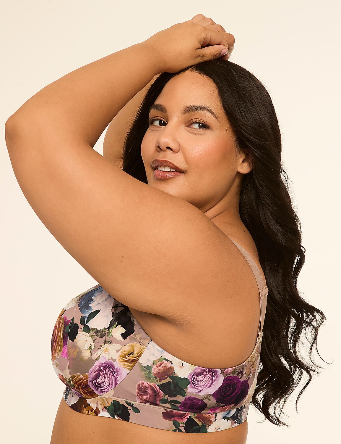 A woman with dark hair and a floral bra poses with her arm raised against a plain, light background. Product Image 3