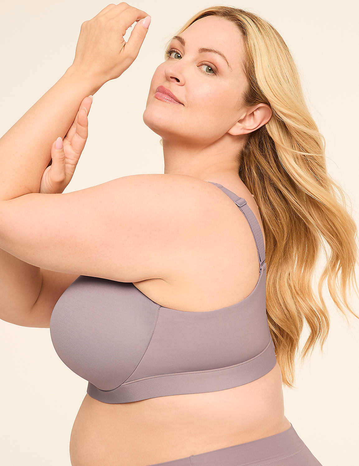 A woman with blonde hair poses in a grey bra against a plain, light background. Product Image 3