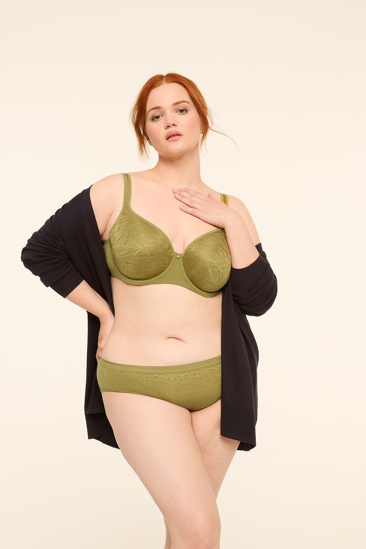 A woman with red hair stands in a light green bra and underwear, with a dark cardigan draped over her shoulders, against a plain, light-colored background. Product Image 5