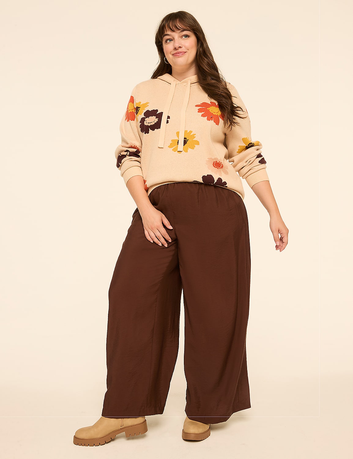A woman in a cream tank top and brown wide-leg pants stands against a plain, light-colored background. Product Image 3