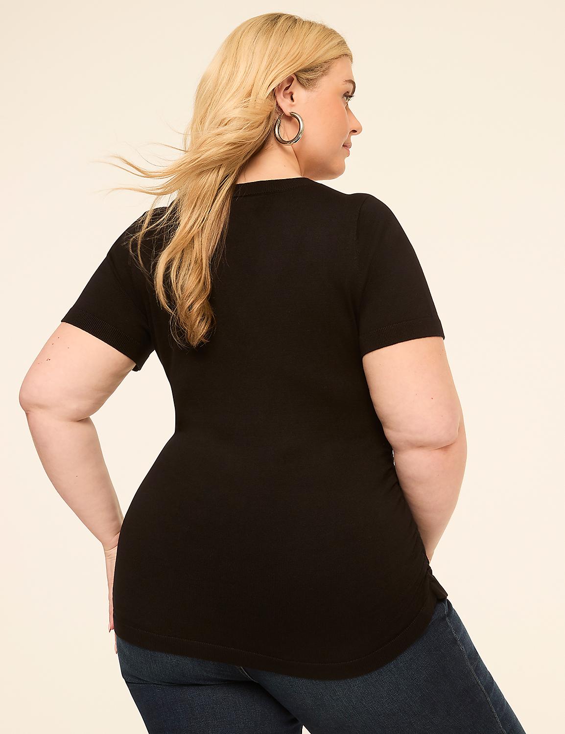 A woman in a black t-shirt and jeans stands against a plain, light-colored background. Product Image 2