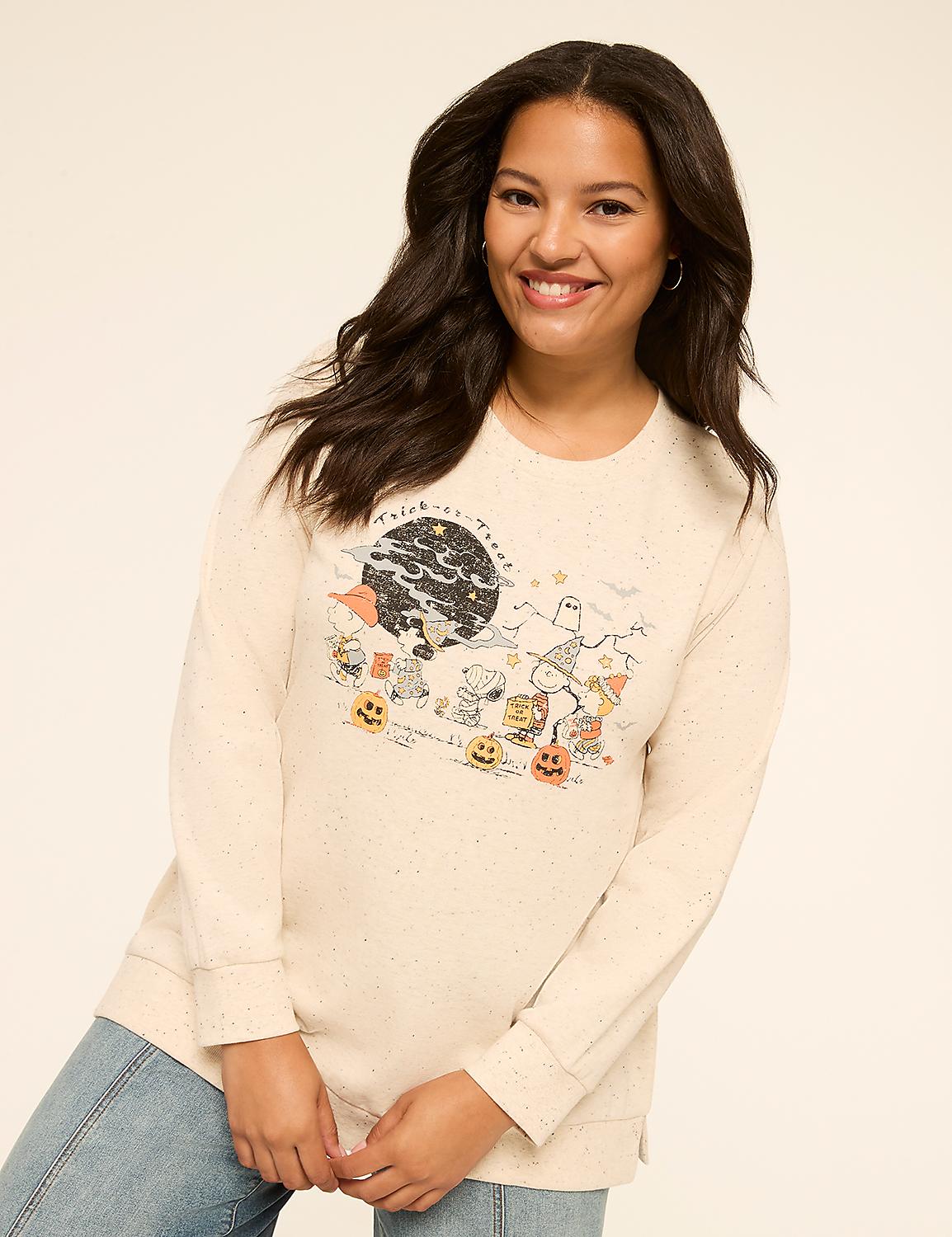 A smiling woman in a cream-colored sweatshirt with a Halloween-themed graphic stands against a plain background. Product Image 1