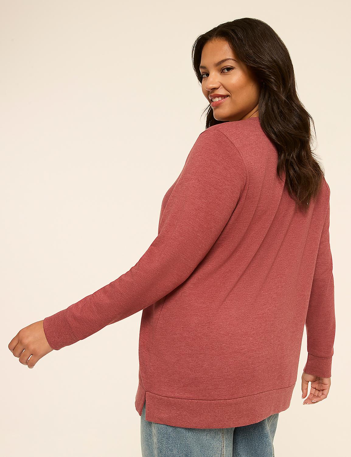 A woman in a rose-colored sweater and jeans turns to smile over her shoulder against a plain, light background. Product Image 2