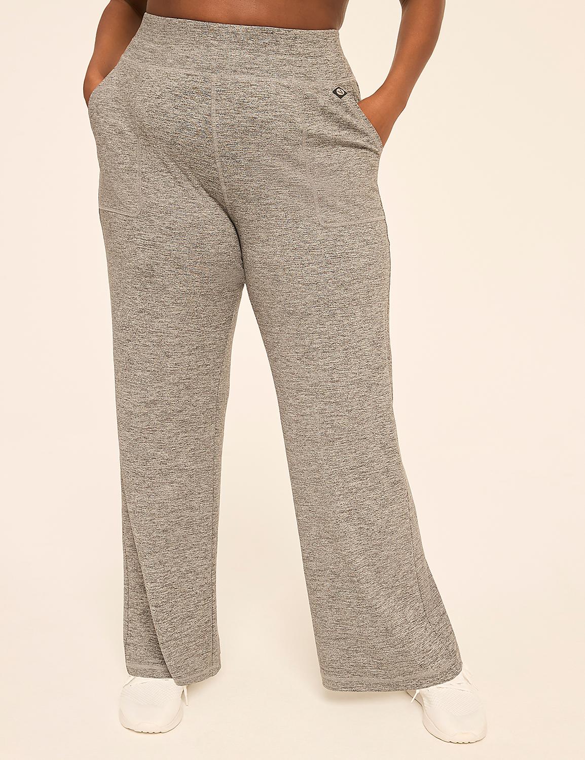 A person stands in heather gray sweatpants and white sneakers against a plain, light-colored background. Product Image 1