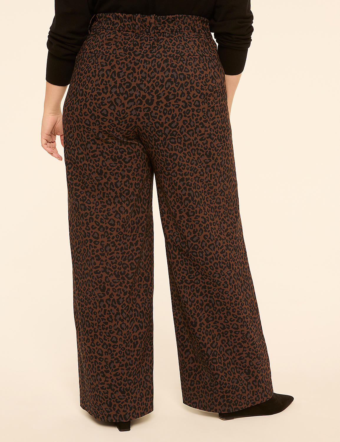A person wearing brown leopard-print wide-leg pants stands against a plain beige background. Product Image 2