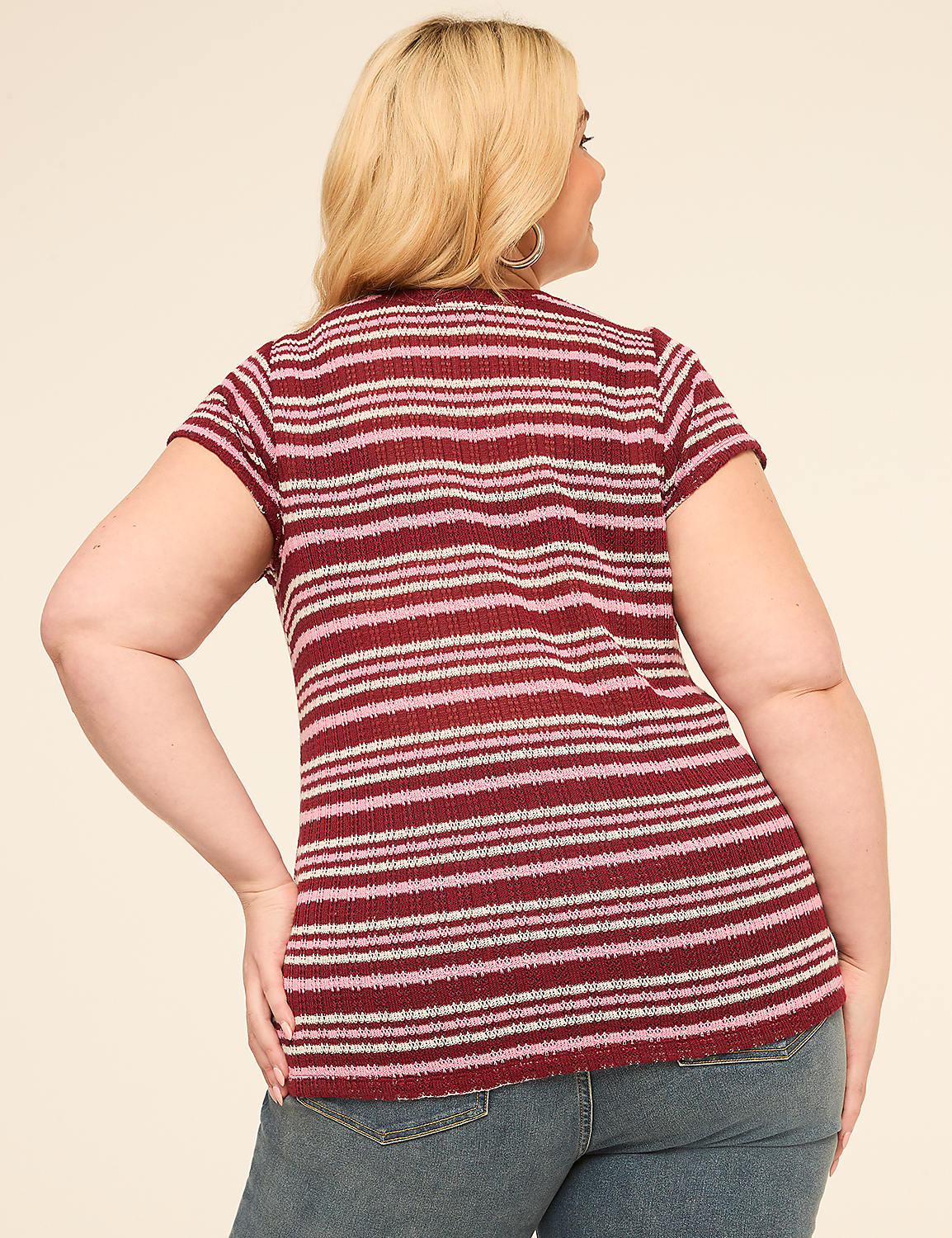 A woman in a striped shirt and jeans stands against a plain, light-colored background. Product Image 2