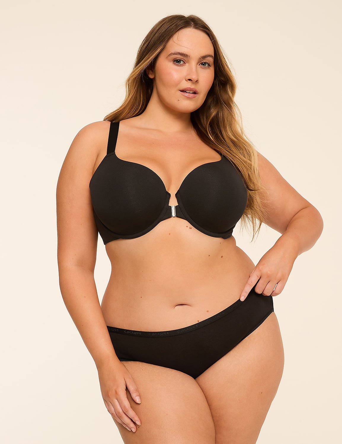 A woman in a black bra and underwear stands against a plain, light-colored background. Product Image 4