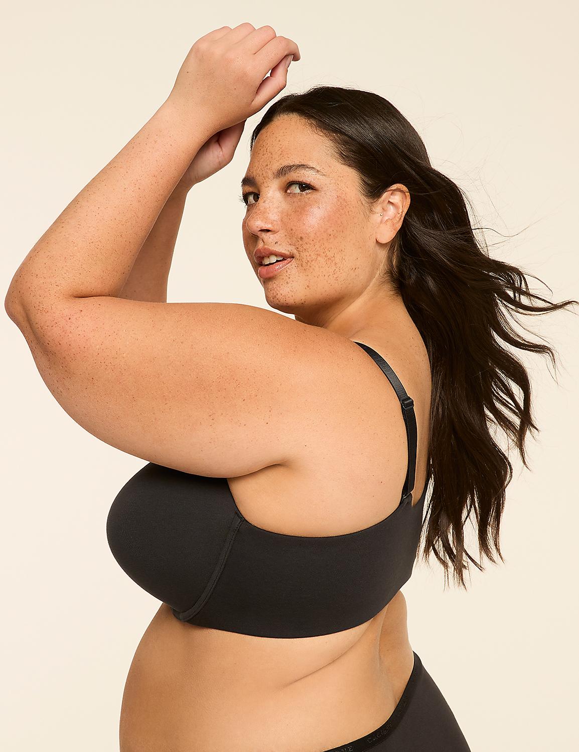 A woman in a black bra poses with her arms raised against a plain, light-colored background. Product Image 3