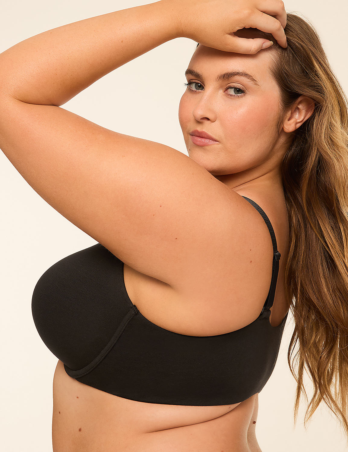 A woman in a black bra poses with her arm raised against a plain, light-colored background. Product Image 3