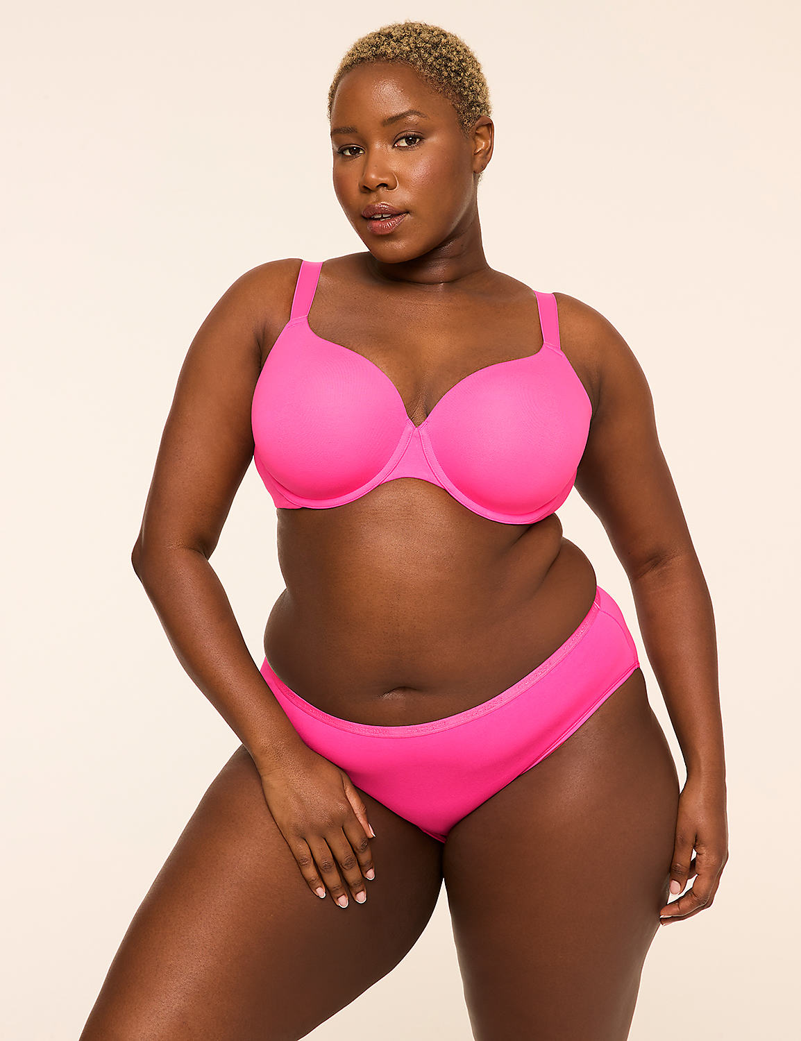 A woman in a bright pink bra and underwear stands against a plain, light-colored background. Product Image 4
