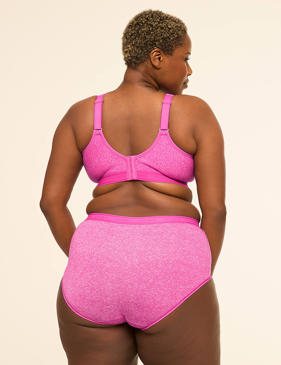 A woman with short, curly hair is shown from behind, wearing a pink bra and matching underwear against a plain, light-colored background. Product Image 2