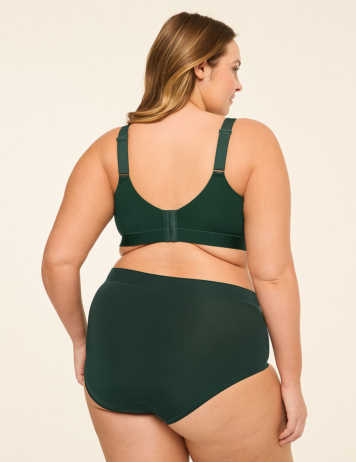 A woman in a green bra and underwear stands facing away from the camera against a plain, light-colored background. Product Image 2