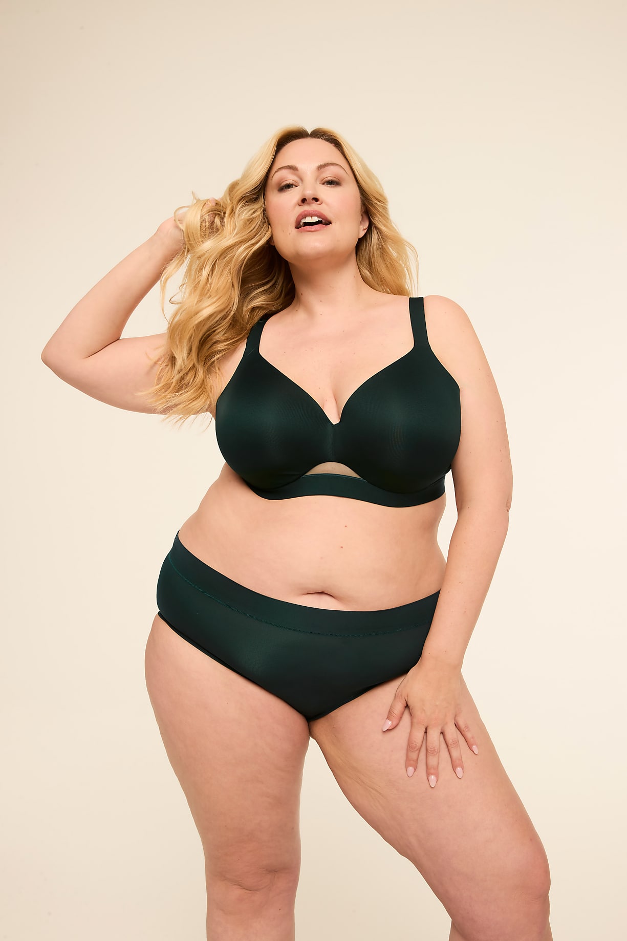A woman with blonde hair poses in dark green lingerie against a plain, light background. Product Image 11
