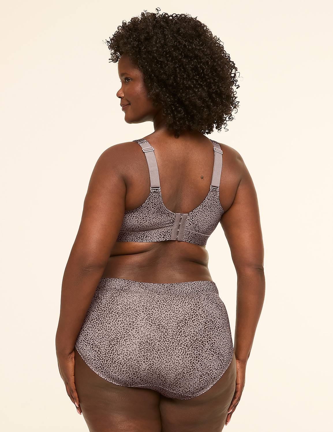 A woman in a patterned bra and underwear stands against a plain, light-colored background. Product Image 2