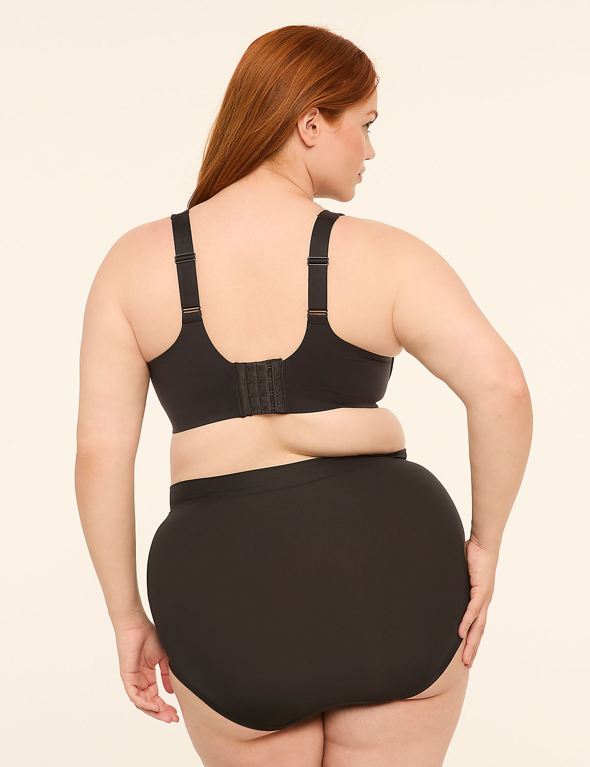 A woman with red hair is shown from the back, wearing a black bra and high-waisted briefs against a plain, light-colored background. Product Image 2