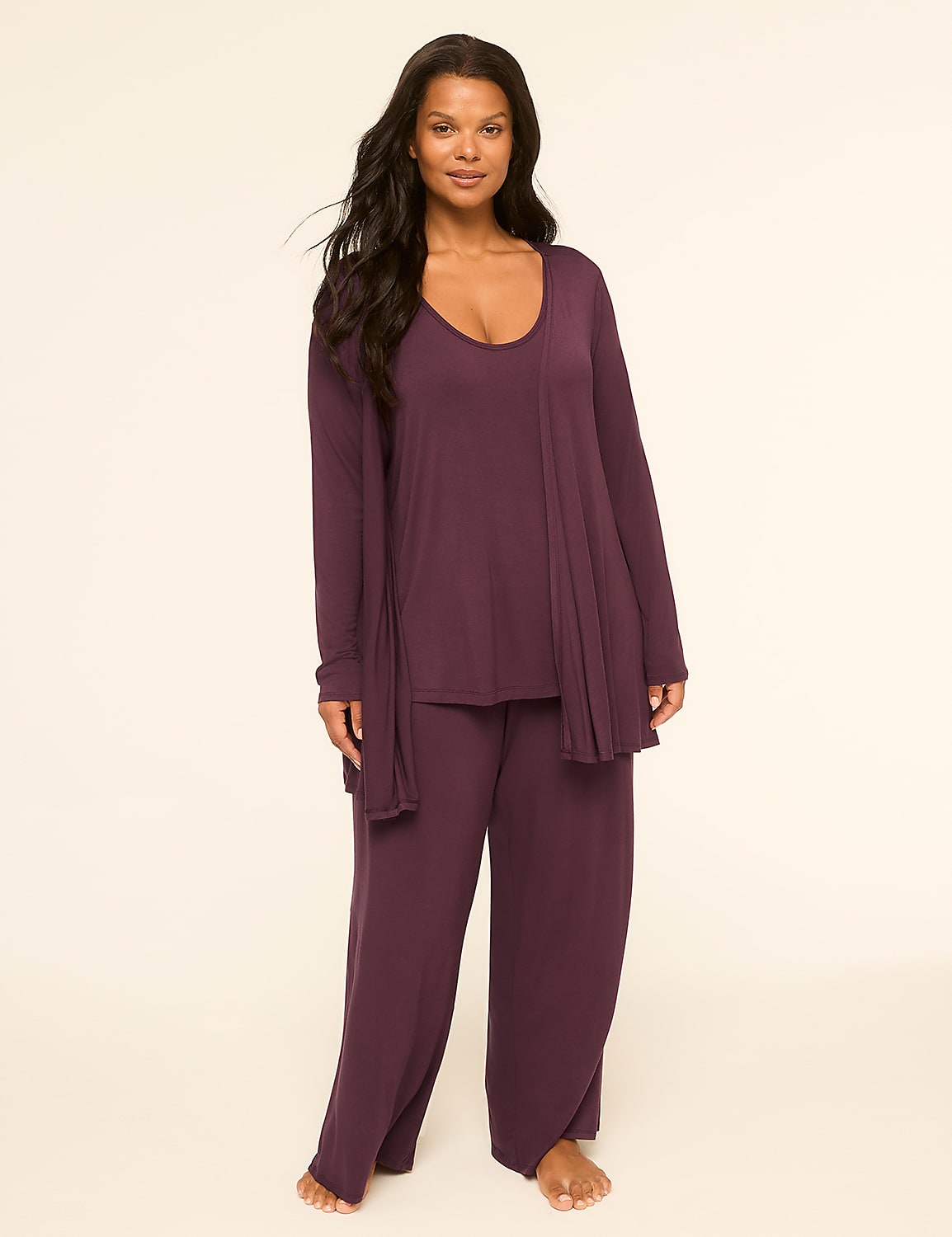 A woman in a plum-colored pajama set stands against a plain, light-colored background. Product Image 1