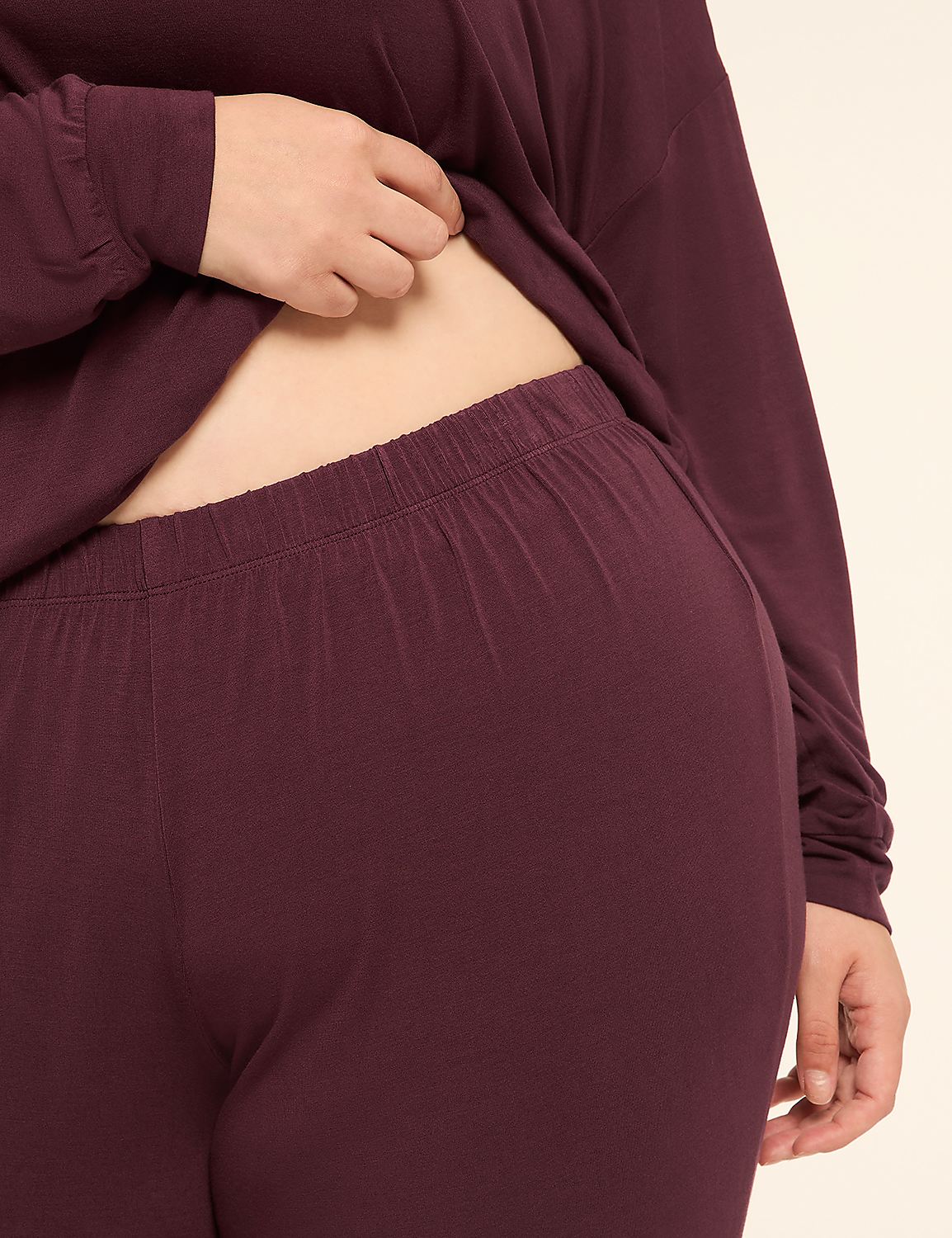 A person's midsection, clad in burgundy loungewear, is shown against a plain, light background. Product Image 3