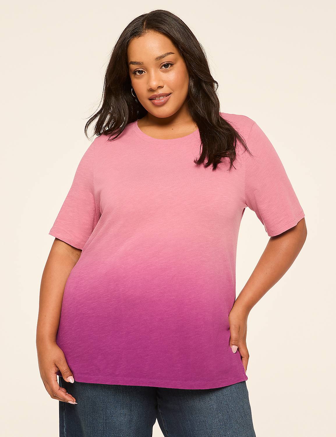 A woman in a pink and purple ombre t-shirt stands against a plain, light-colored background. Product Image 1