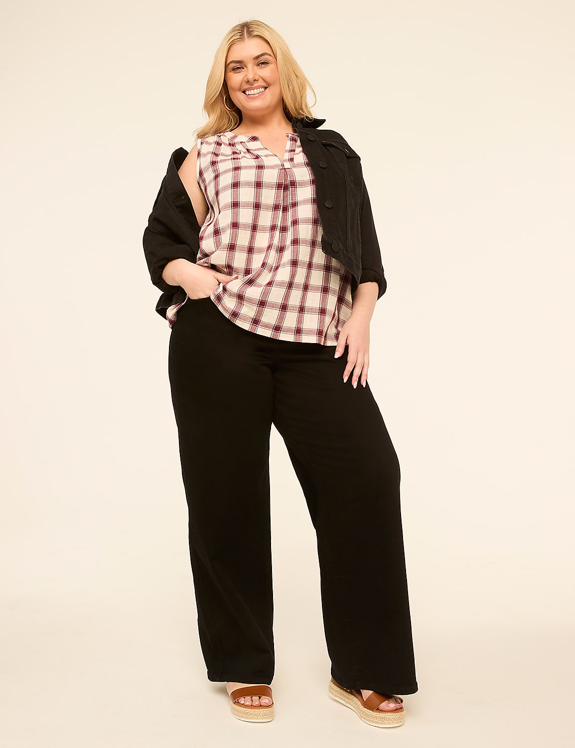 A woman in a plaid top and black pants stands against a plain, light-colored background. Product Image 3