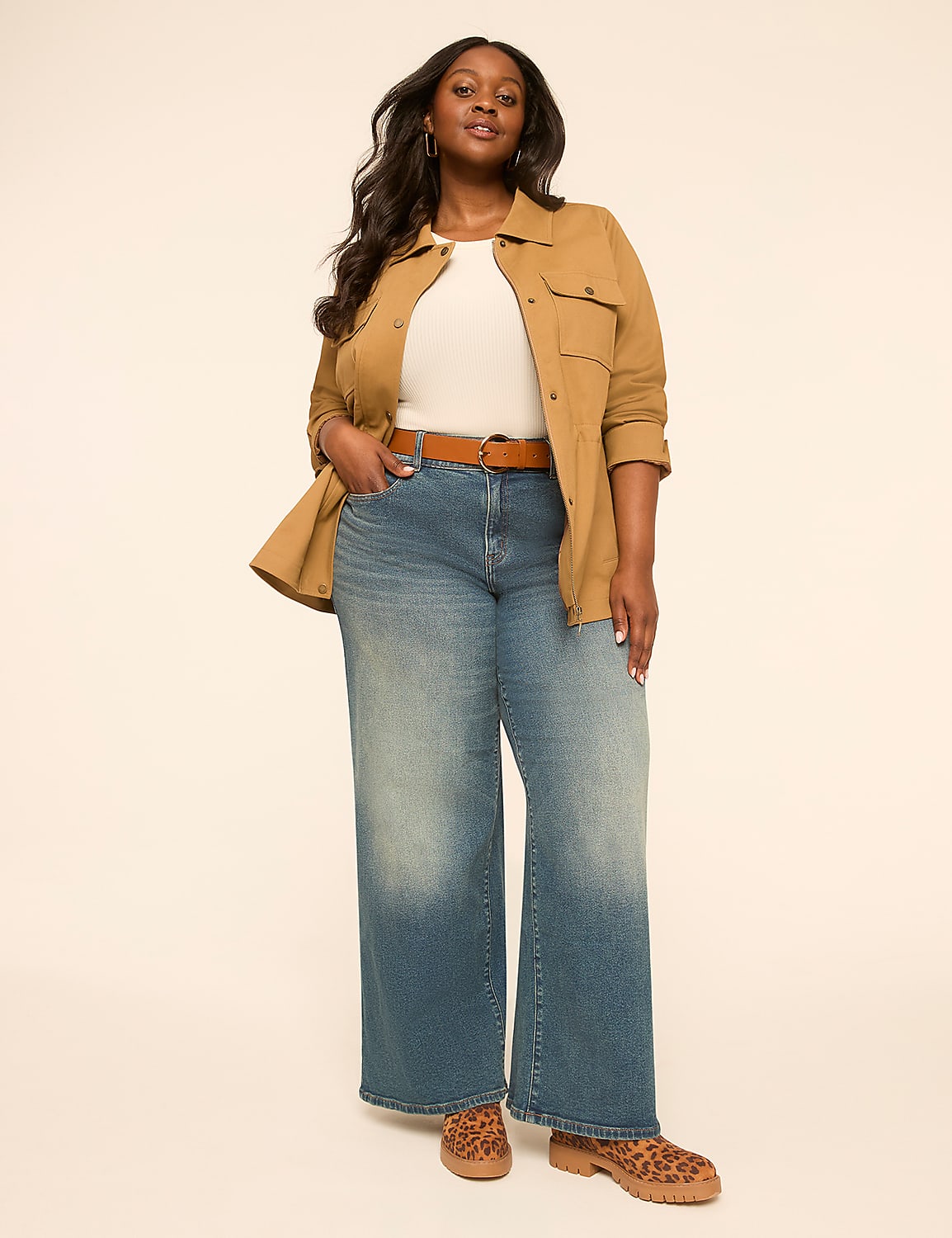 A woman in wide-leg jeans and a tan jacket stands against a plain, light-colored background. Product Image 3