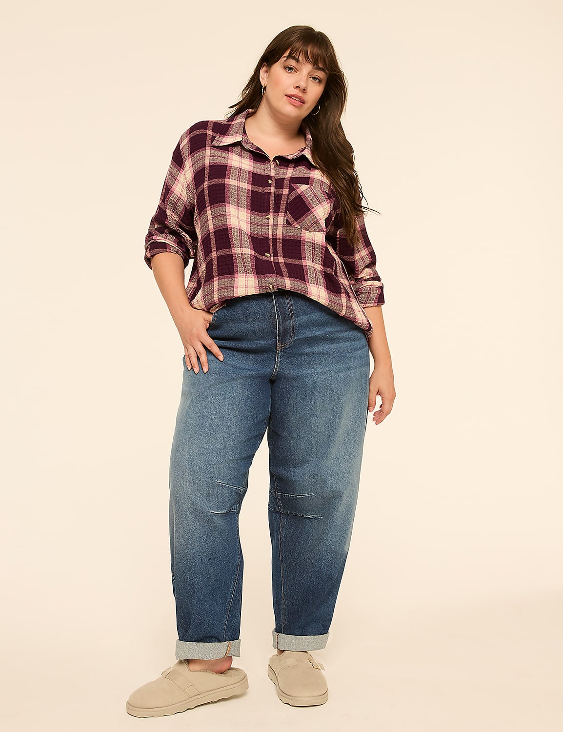 A woman in a plaid shirt and baggy jeans stands against a plain, light-colored background. Product Image 3