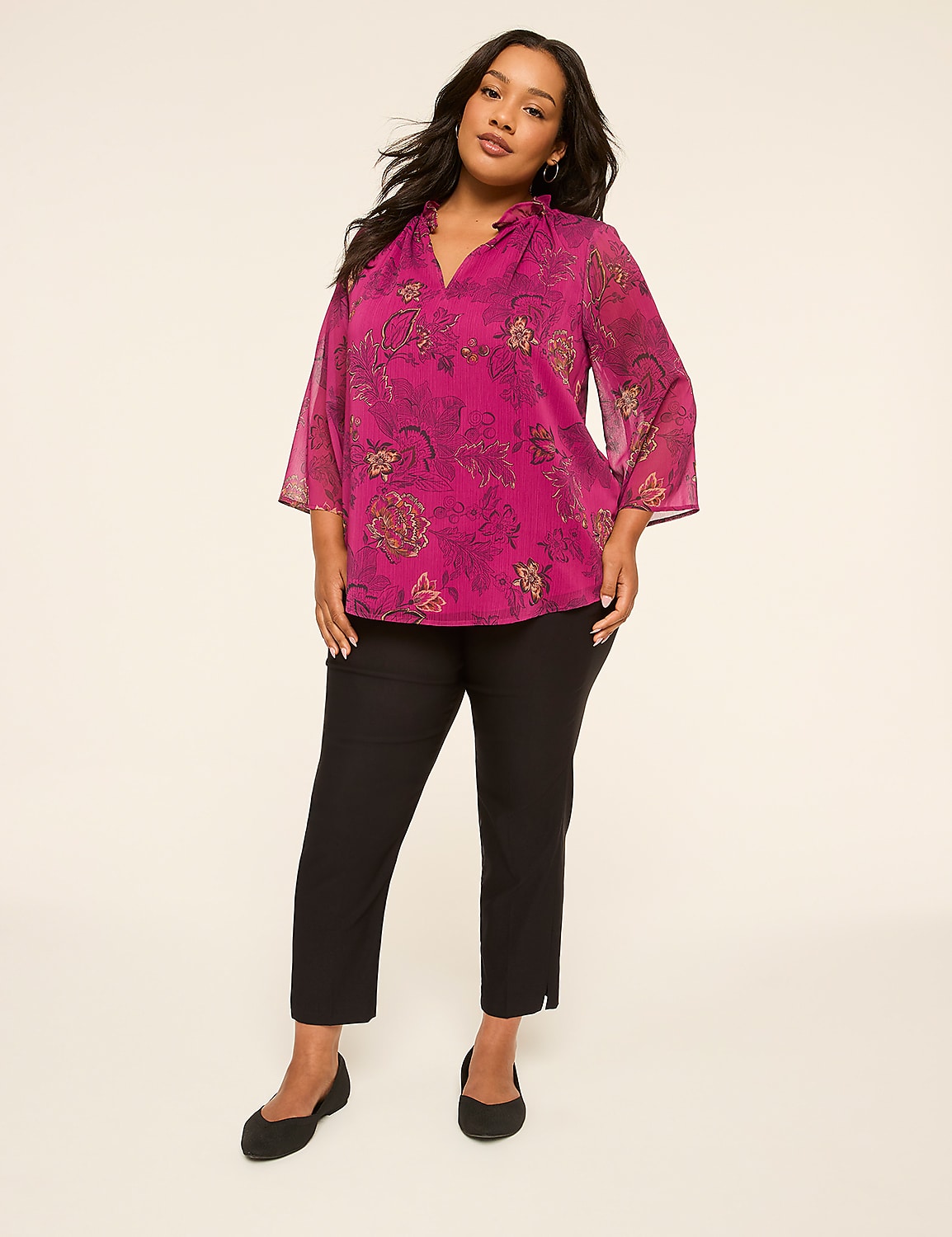 A woman in a pink paisley blouse and black pants stands against a plain, light-colored background. Product Image 3